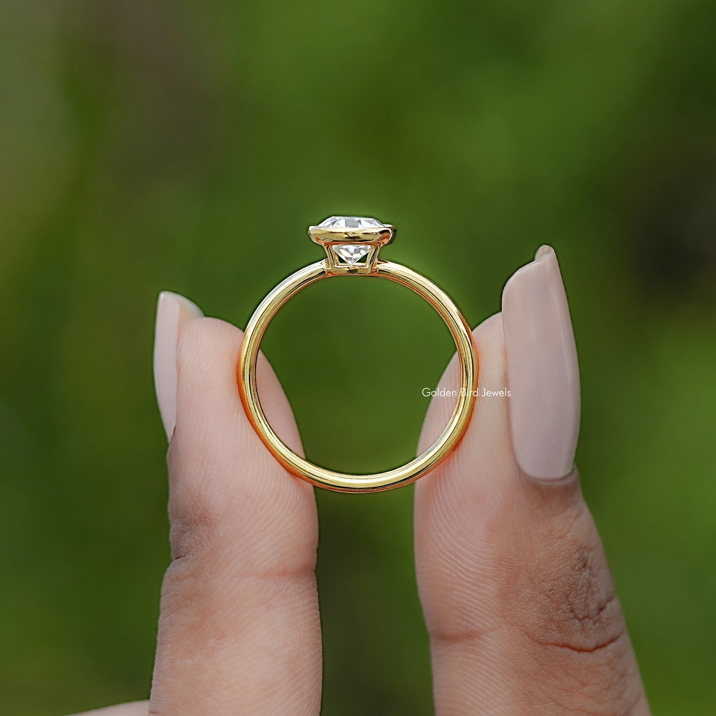 Back view of Round Cut Solitaire Engagement Ring in secure setting 