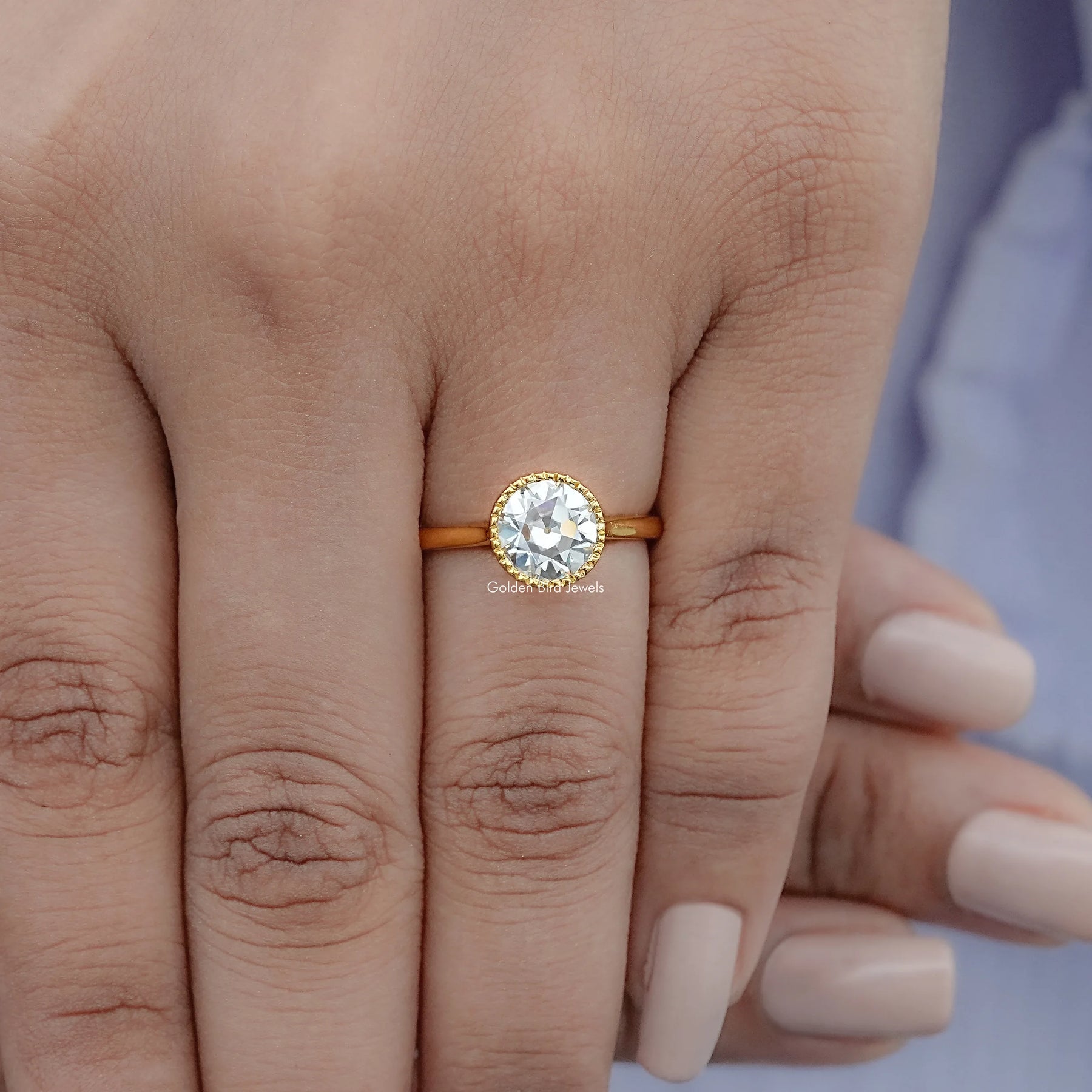 View of Round Cut Solitaire Engagement Ring in prongs setting