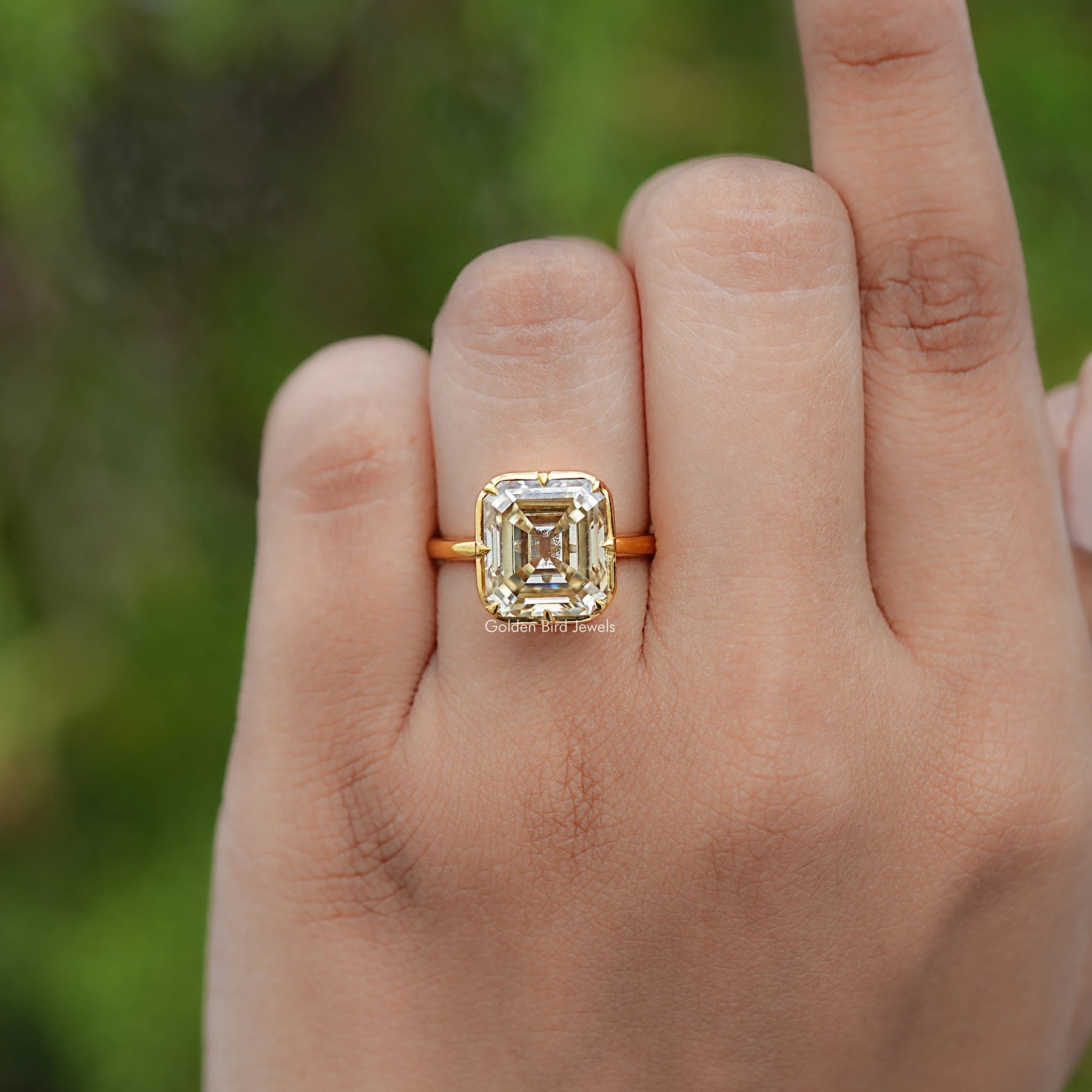 In finger view of Old Mine Asscher Moissanite Solitaire Ring
