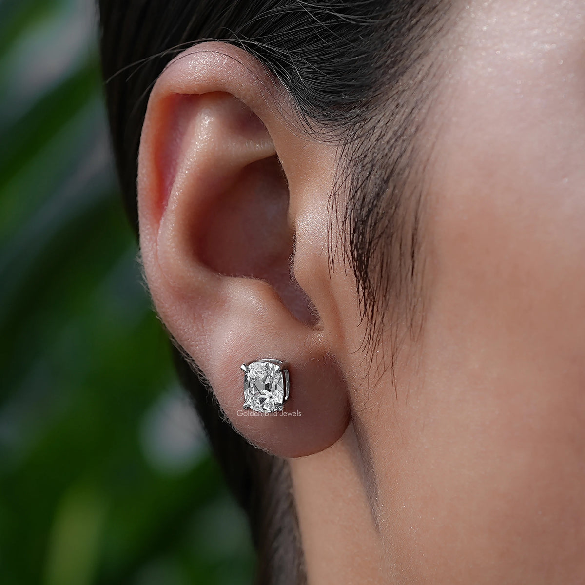 In-Ear View Of Diamond Stud Earrings in four prongs setting