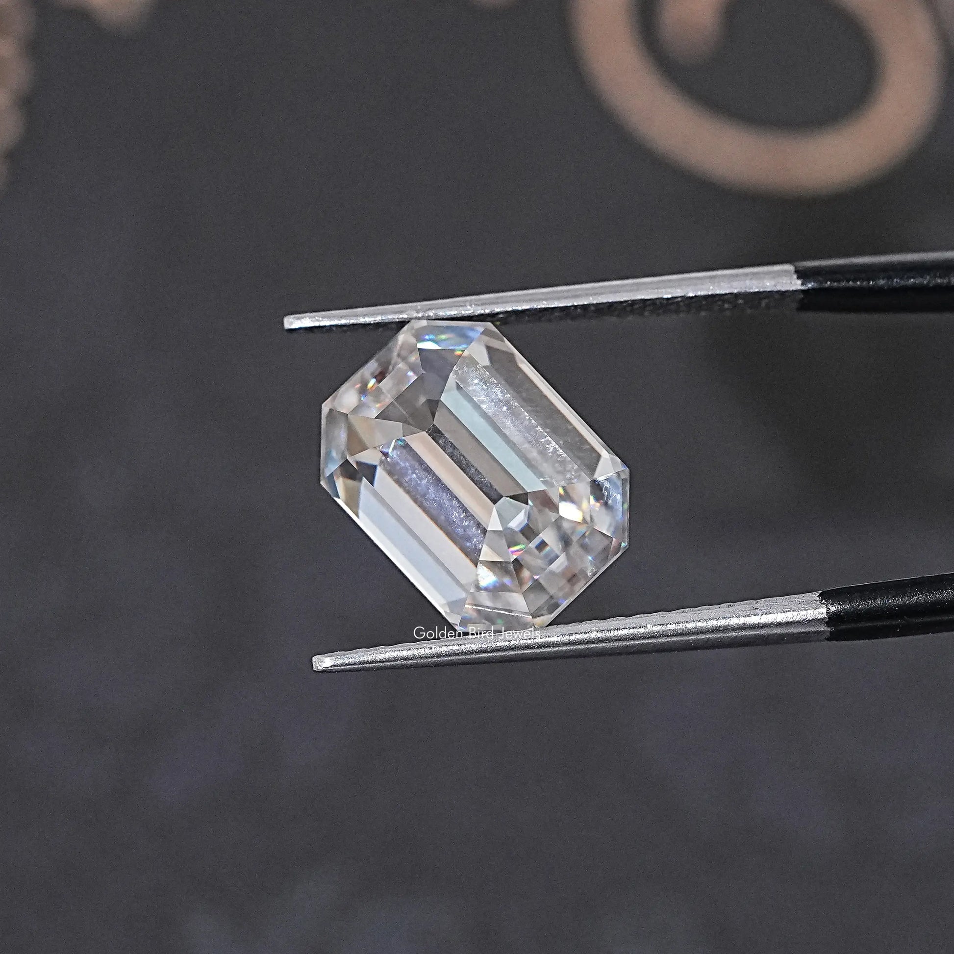 In Tweezer View Of Old Mine Emerald Cut Loose Moissanite