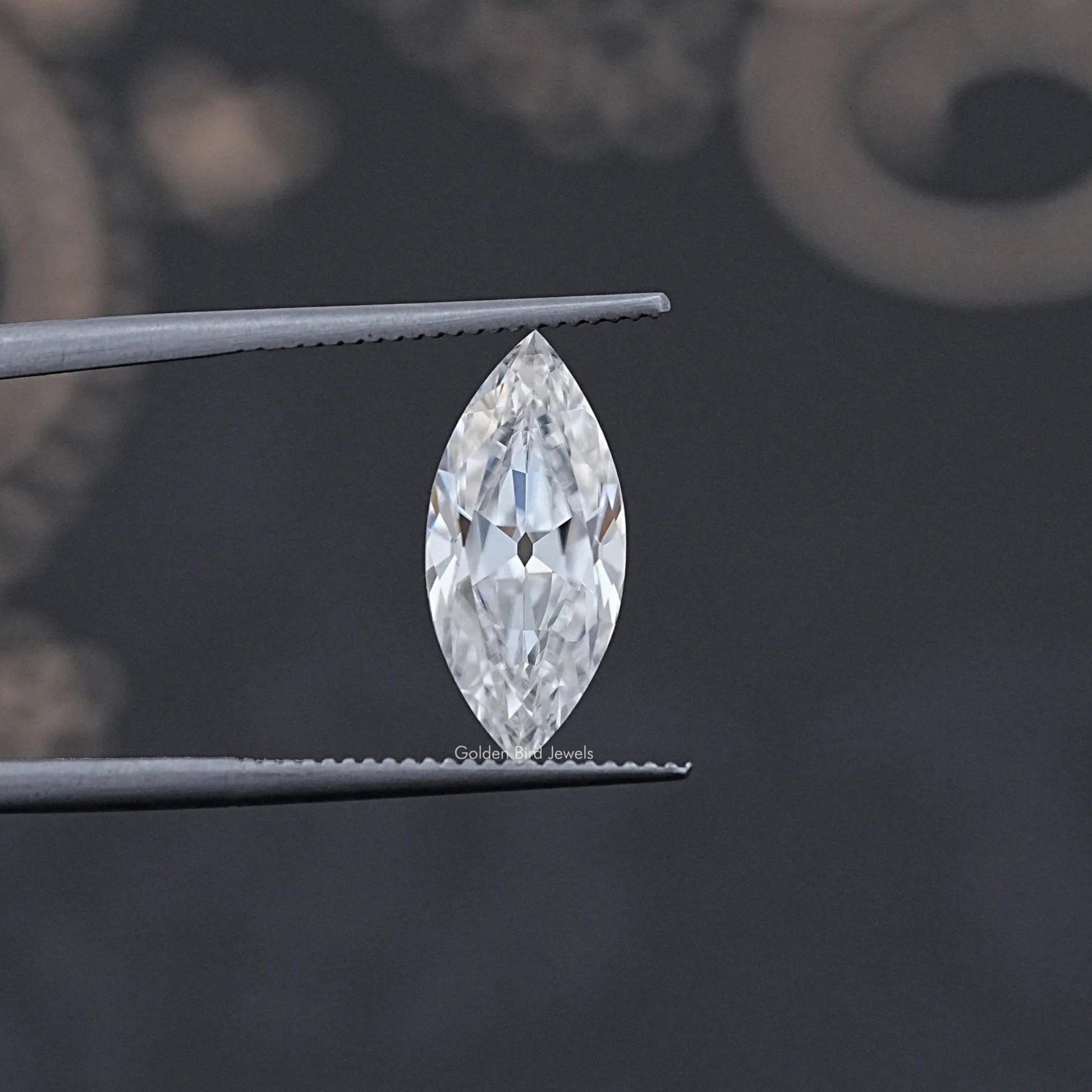 In Tweezer View Of Old Mine Marquise Cut Moissanite Loose Stone
