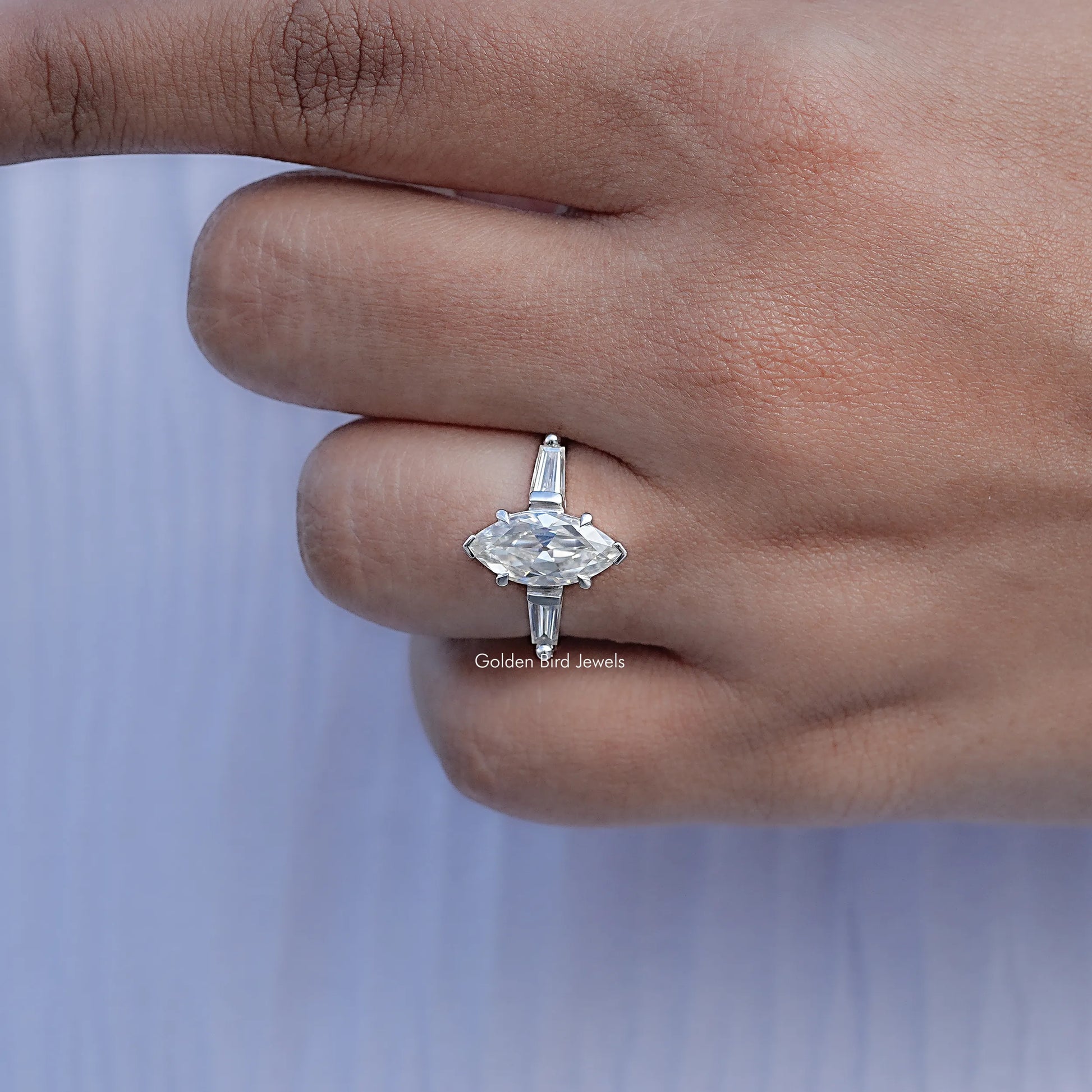 Close View Of Three Stone Marquise Moissanite Ring