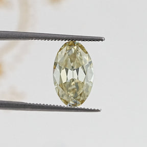 In Tweezer View Of Old Mine Oval Cut Loose Moissanite Stone