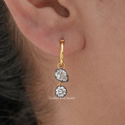 In Ear view of Old Mine Pear And Round Moissanite Dangle Hoop Earrings