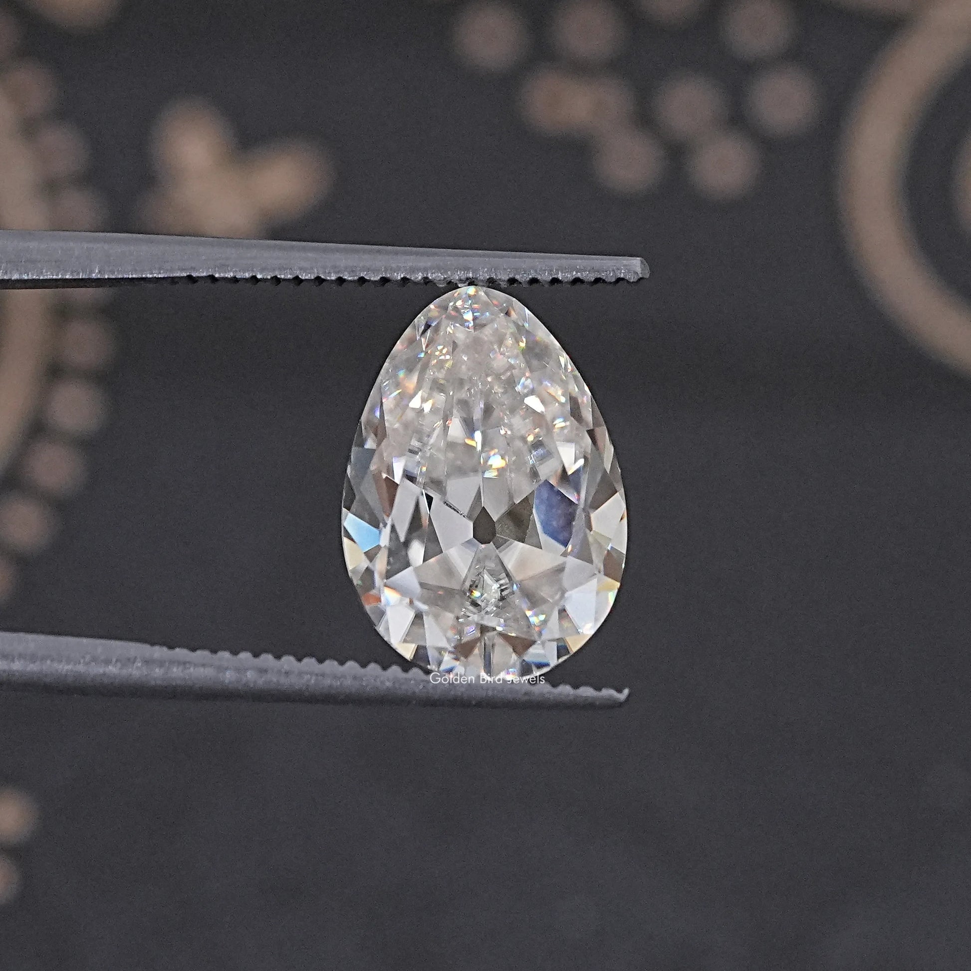 In Tweezer View Of Old Mine Oval Cut Loose Moissanite Stone