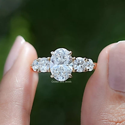 Oval Cut Lab Grown Diamond Five Stone Ring in Two Fingers