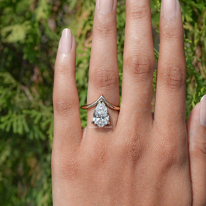 View of Pear Cut Yellow Gold Curved V Shaped Solitaire Ring In Finger 
