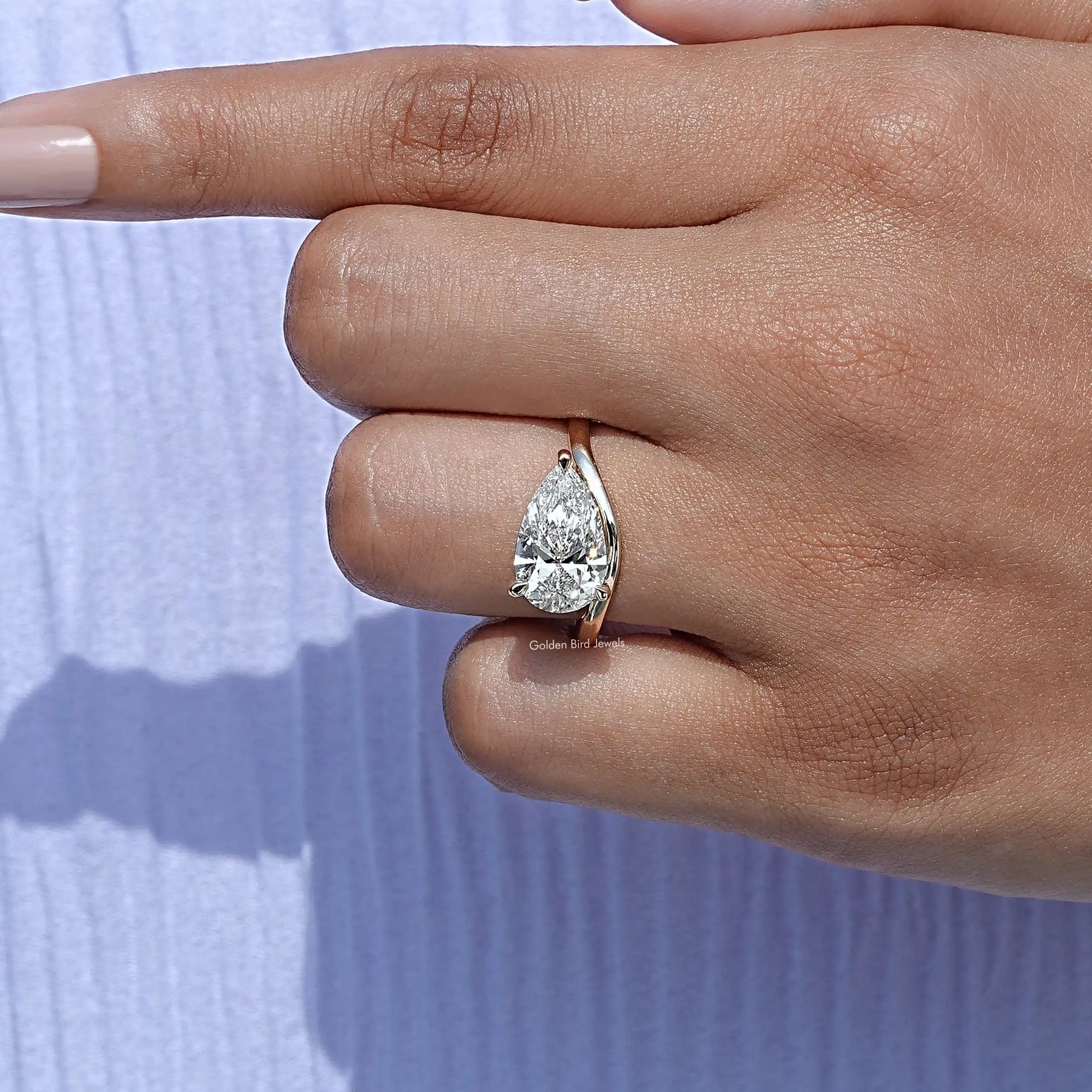 View of Pear Cut Lab Diamond Halo Ring in prongs setting 
