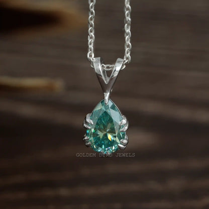 Front view of blue pear cut moissanite pendant made of double claw setting