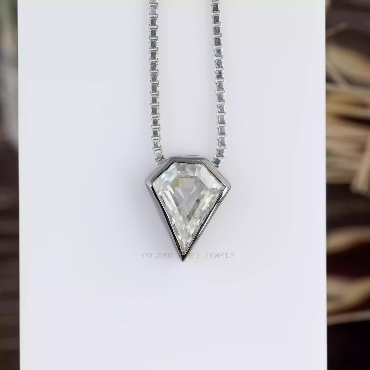 Front view of moissanite pendant crafted with bezel setting