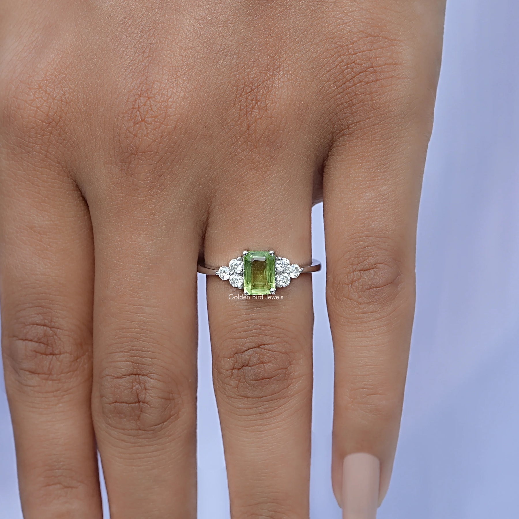 Detailed View of Green Emerald Cut Gemstone Accent Set Ring In White Gold