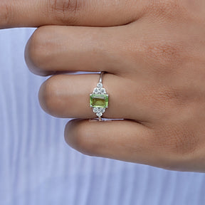 Close-Up View of Peridot Green Gemstone Emerald Cut Ring In White Gold