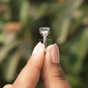 Side View of Portrait Cut Princess Three Stone Ring In two fingers