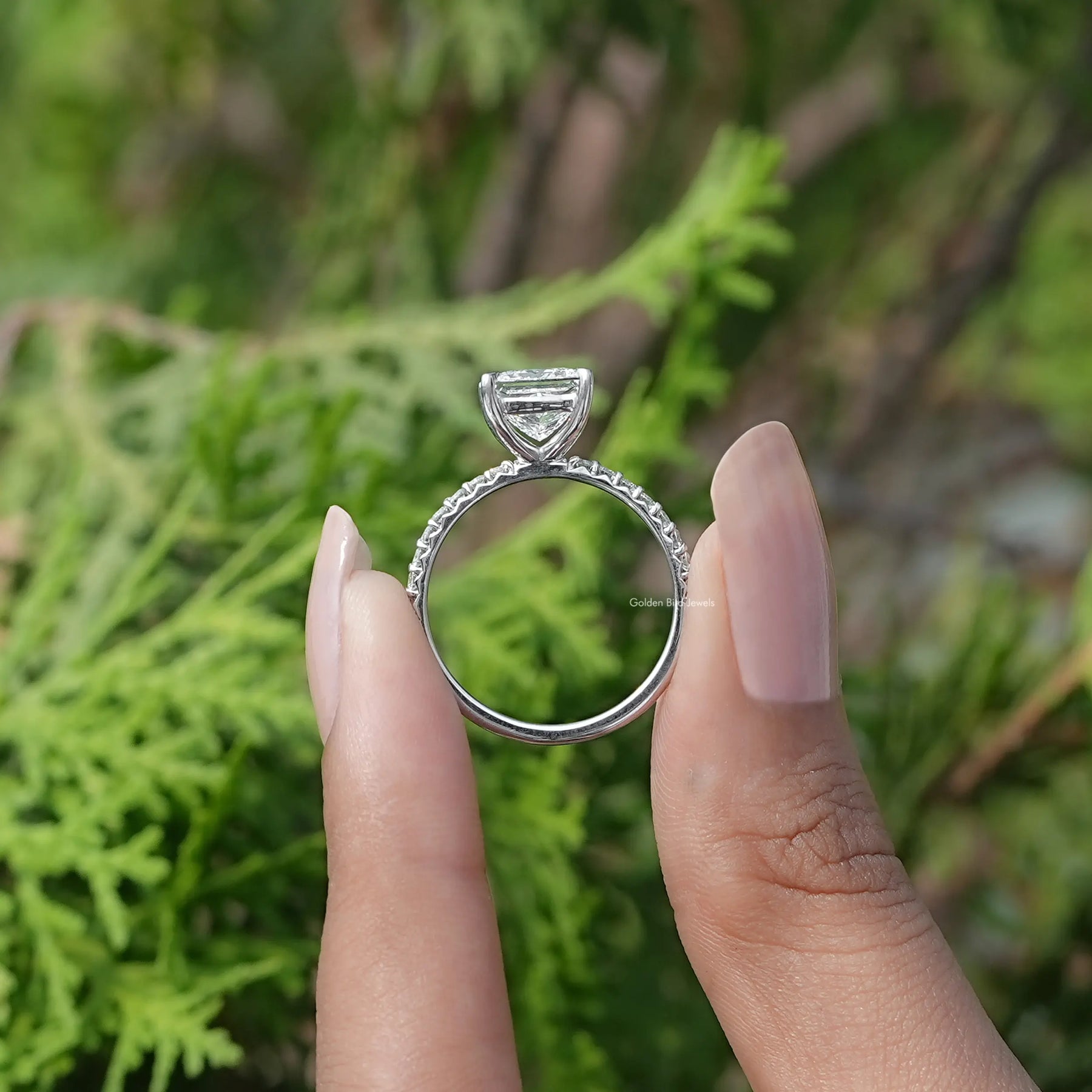 Back View of Princess Cut Lab Diamond Accent Ring In two fingers