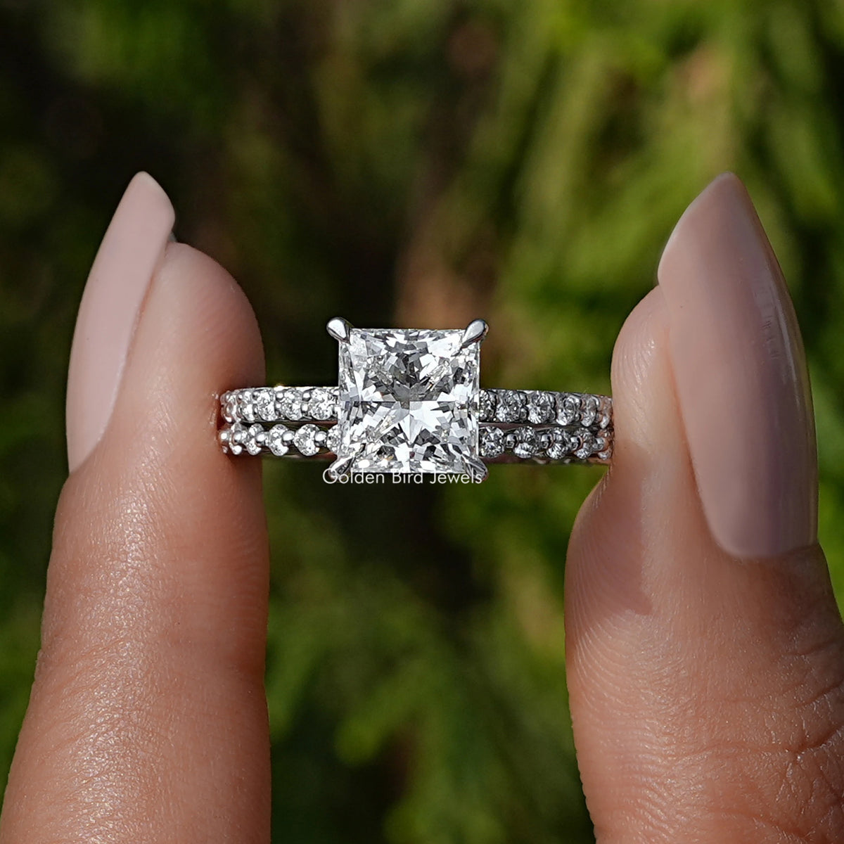 Front View A Princess Cut Lab Grown Diamond Ring in a two fingers
