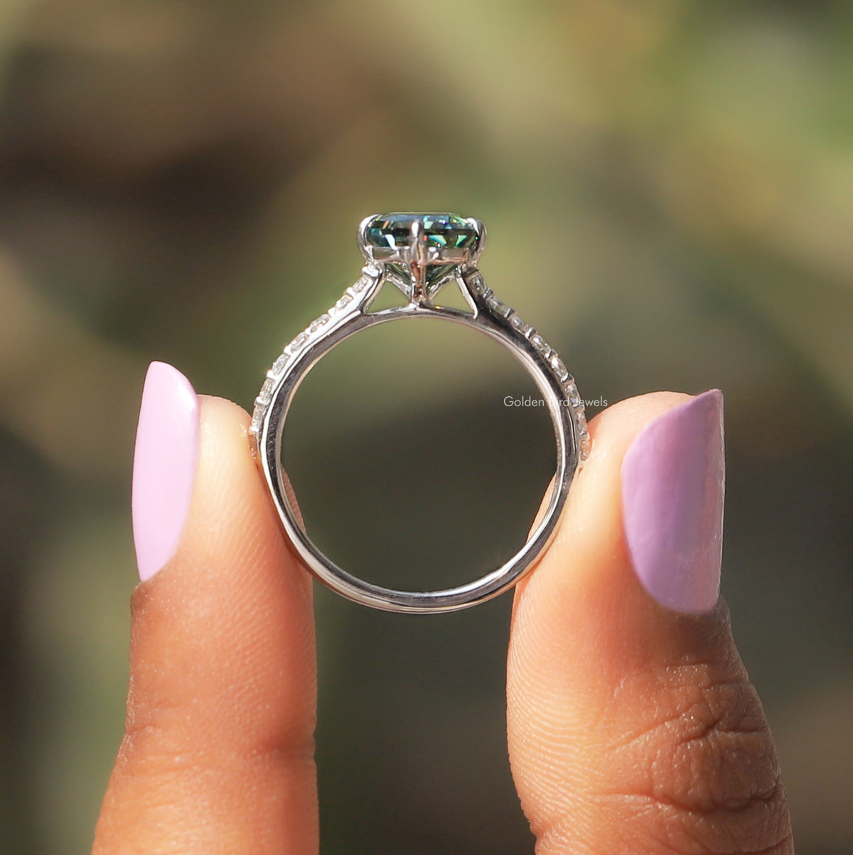 Back View of Radiant Cut Accent Stone Ring In two fingers