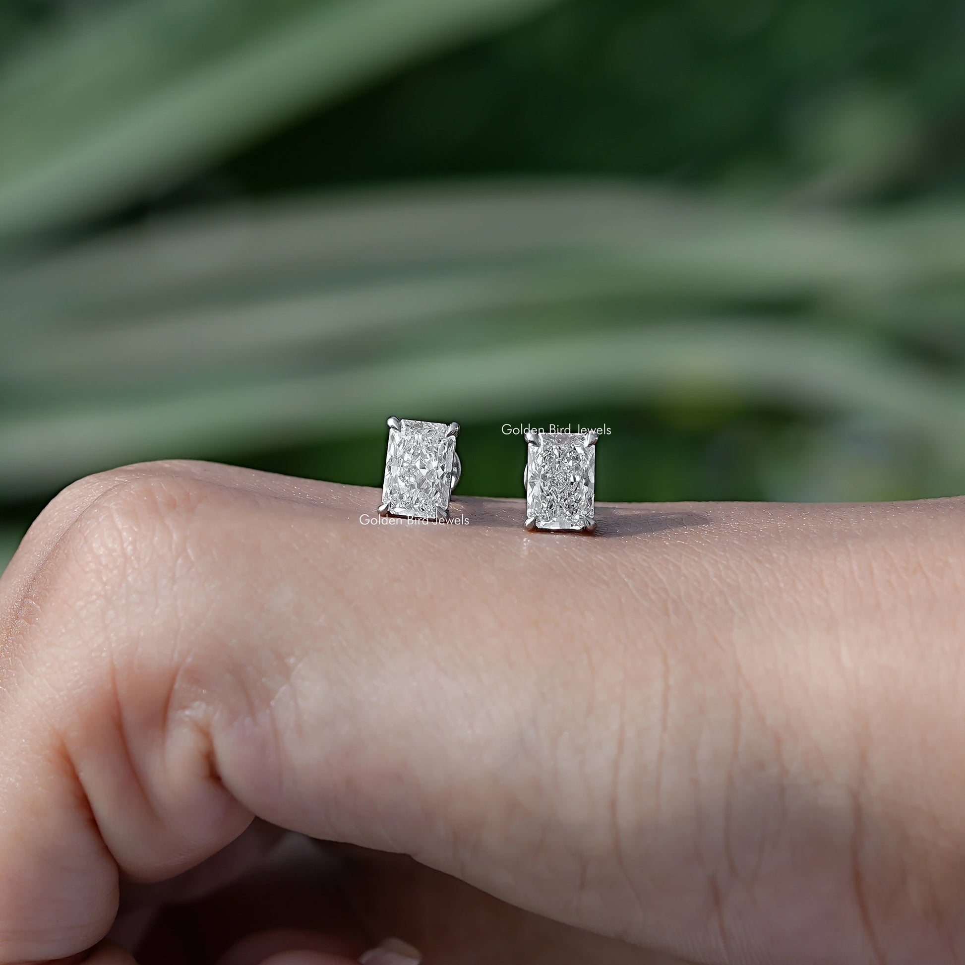 In Hand View Of radiant shaped diamond Stud Earring