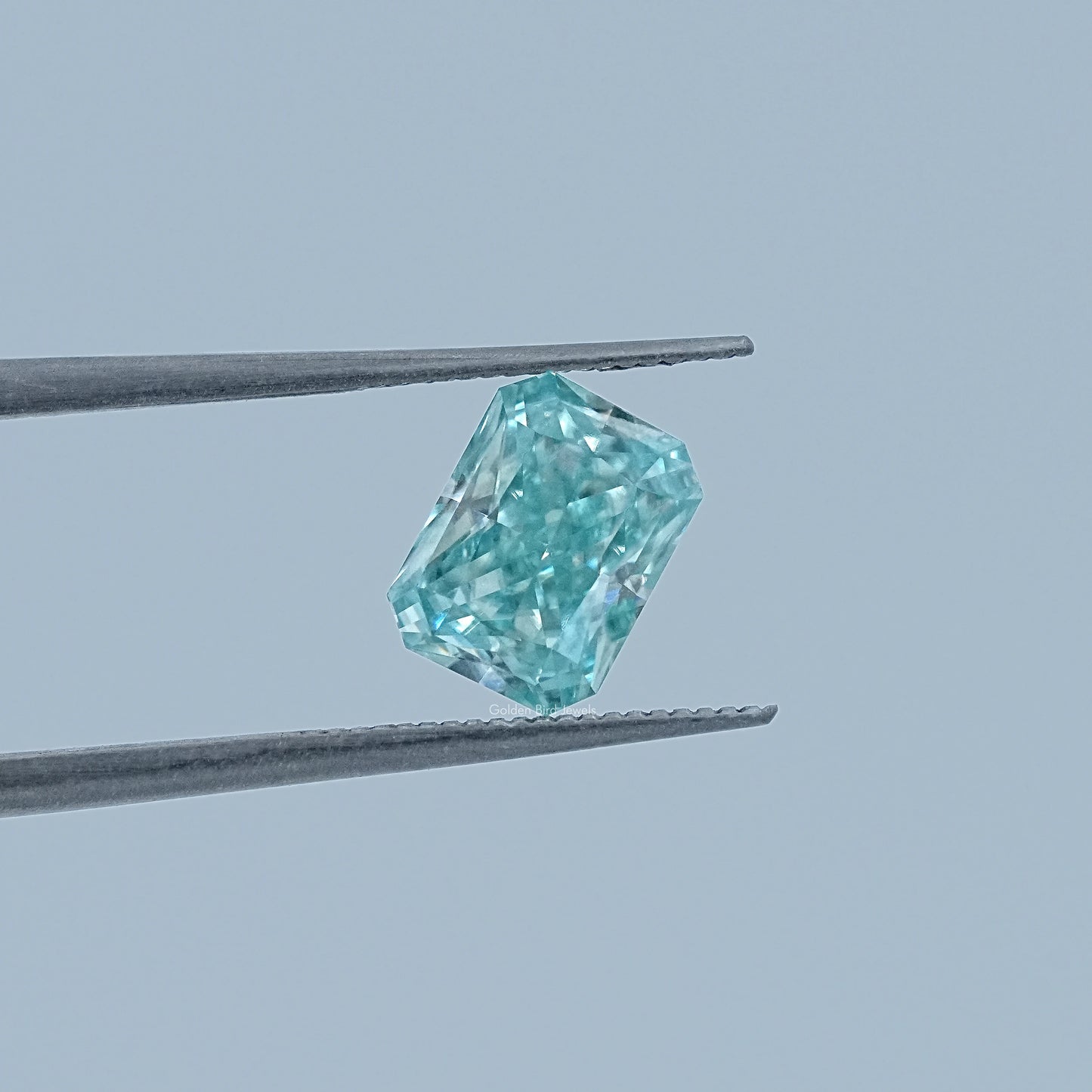 In Tweezer View Of Radiant Cut Loose Moissanite