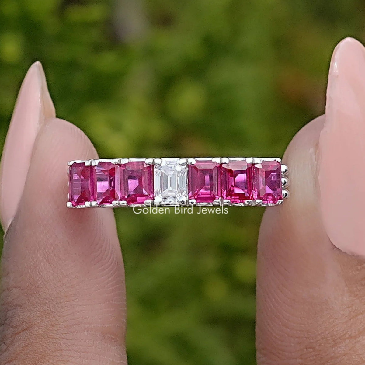 Front View of Red Ruby Emerald Shaped Gemstone Seven Stone Band
