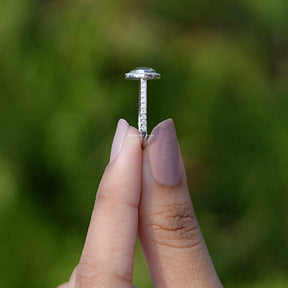 Side View of Rose Cut Pear Moissanite Ring In two fingers