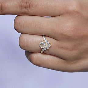 View of Round Moissanite Curved Accent Ring In Finger