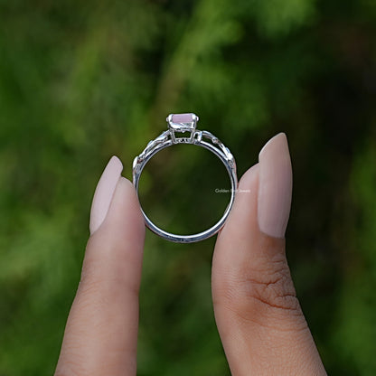 Back View of Round Gemstone Leaf Style Solitaire Ring In two fingers
