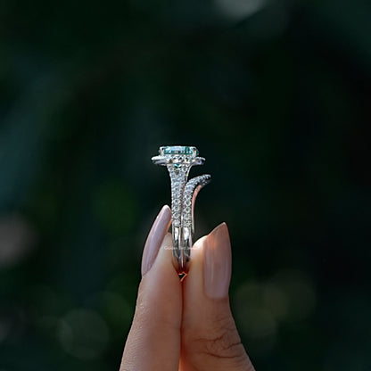 Side View of Round And Oval Cut Bridal Ring Set In two fingers