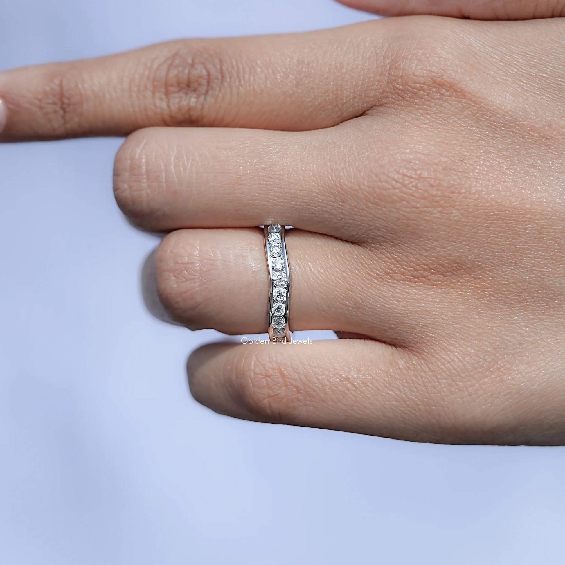 In front finger View Of Round Cut Moissanite solitaire Ring 