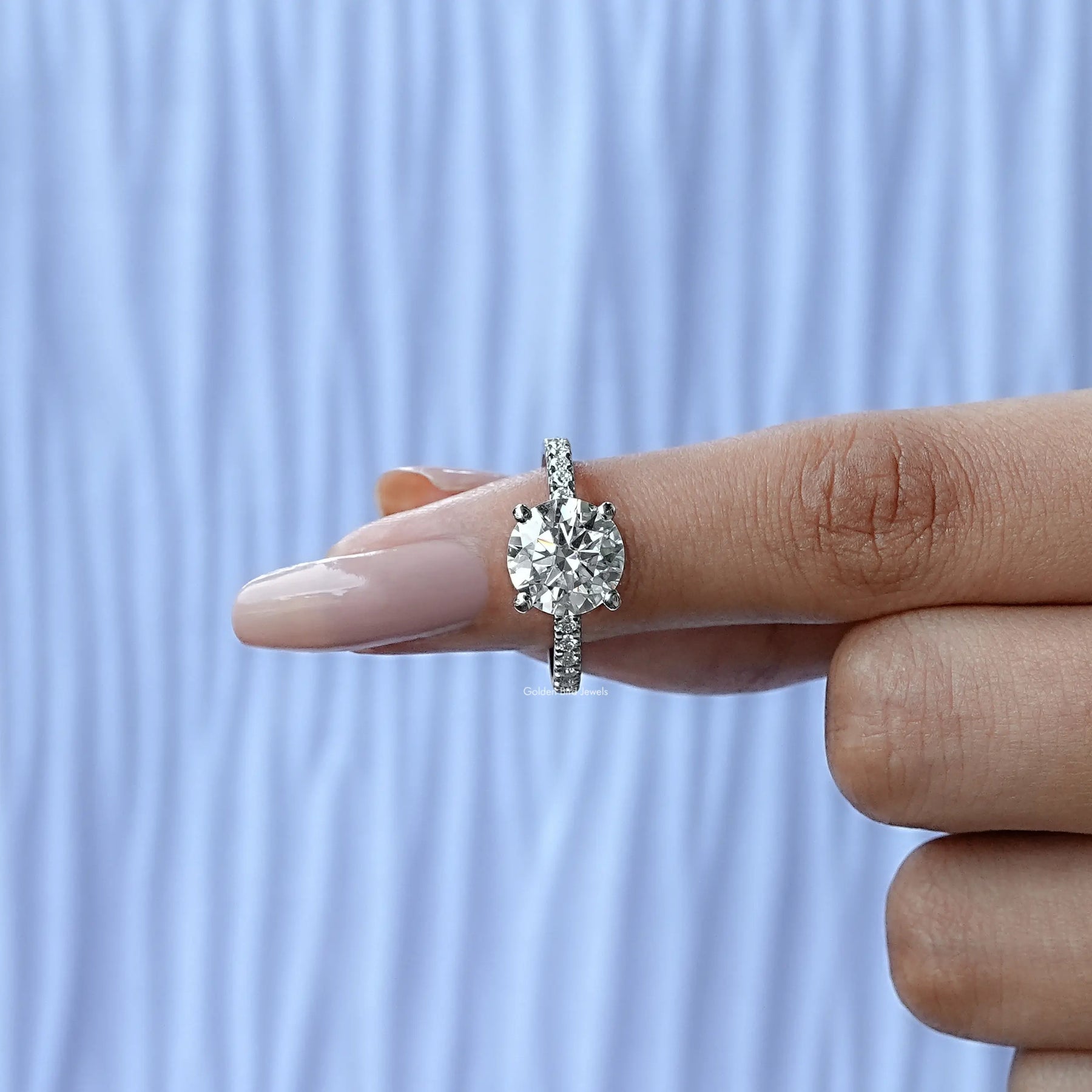 In finger front View of Round Cut Moissanite Accent Stone Ring