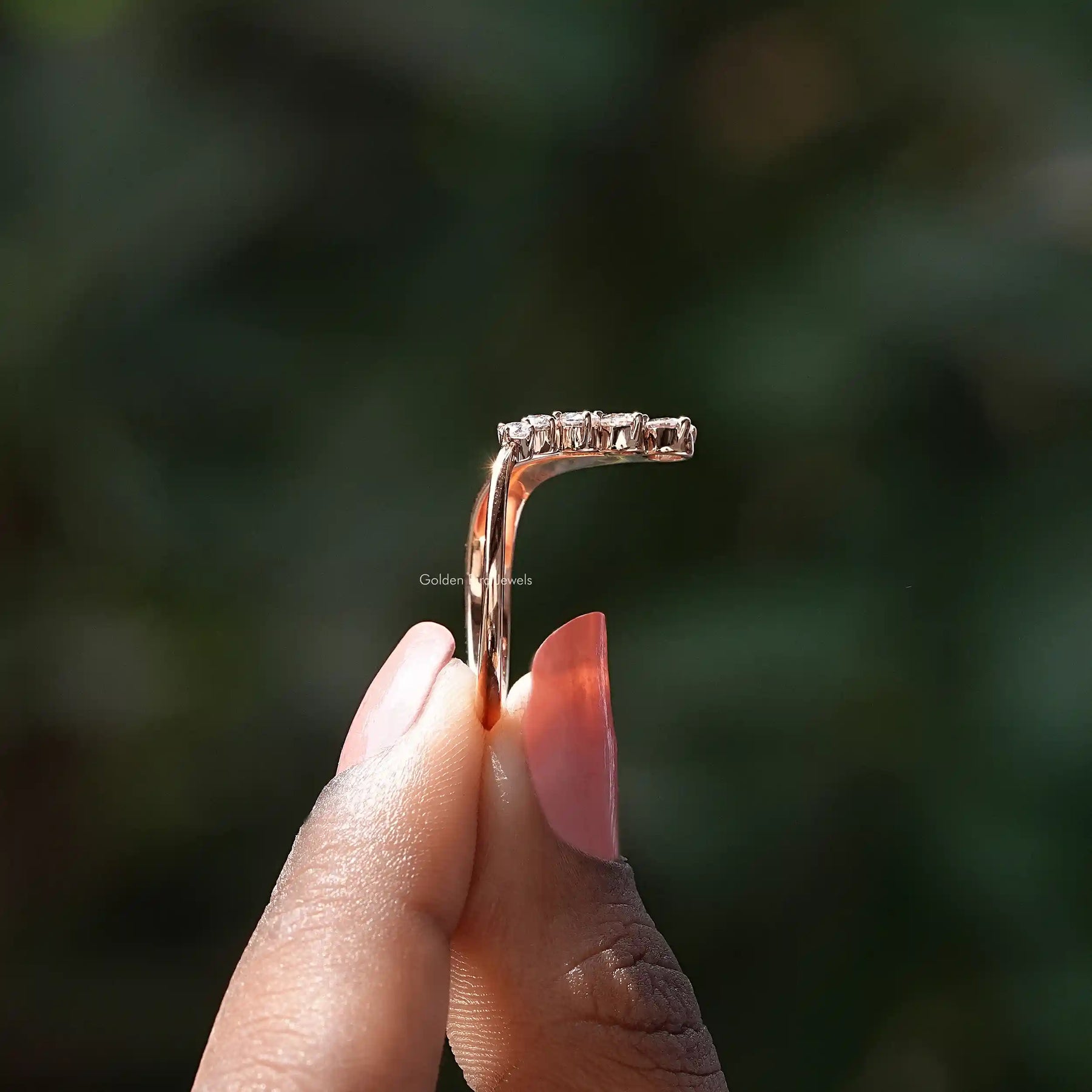 Side View of Moissanite V Shaped Chevron Ring In two fingers