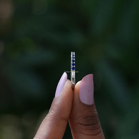 Side view of September Birthstone Sapphire Blue Round Eternity Band