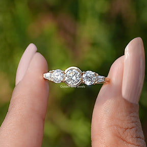 Front View of Round Cut Lab Diamond Five Stone Ring In two Fingers