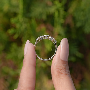 Back View of Round Lab Grown Diamond Five Stone Ring In two fingers