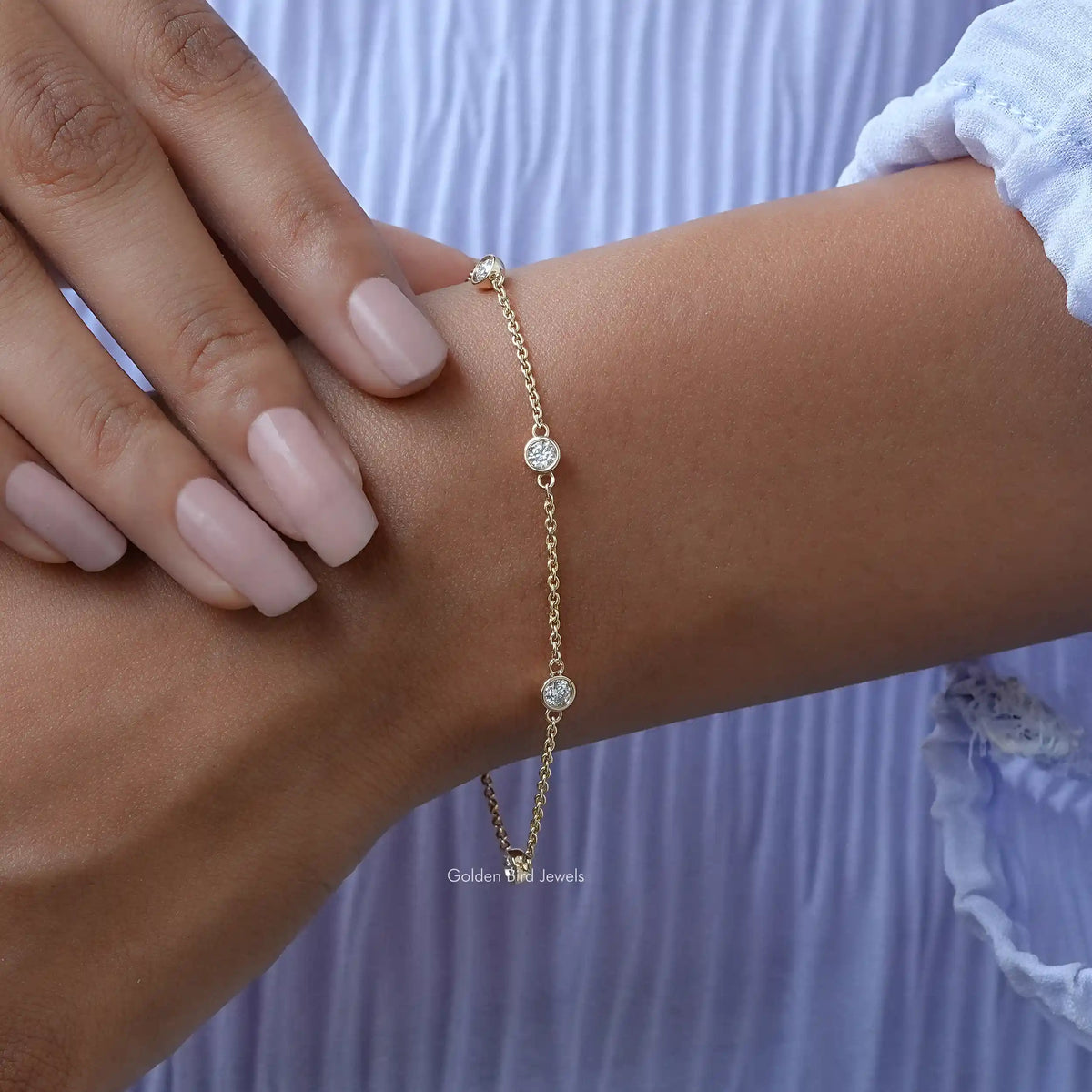 In hand view of moissanite chain bracelet