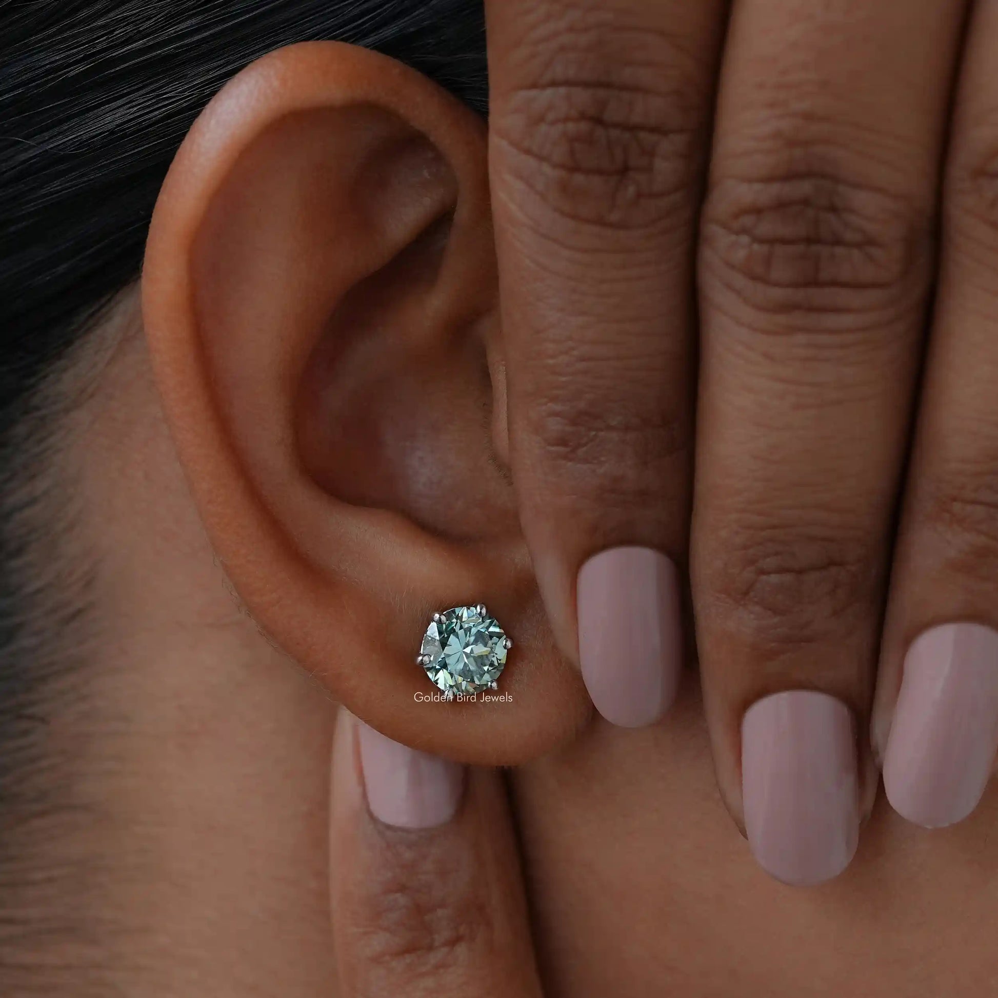 Close view of moissanite stud earrings in unique design 