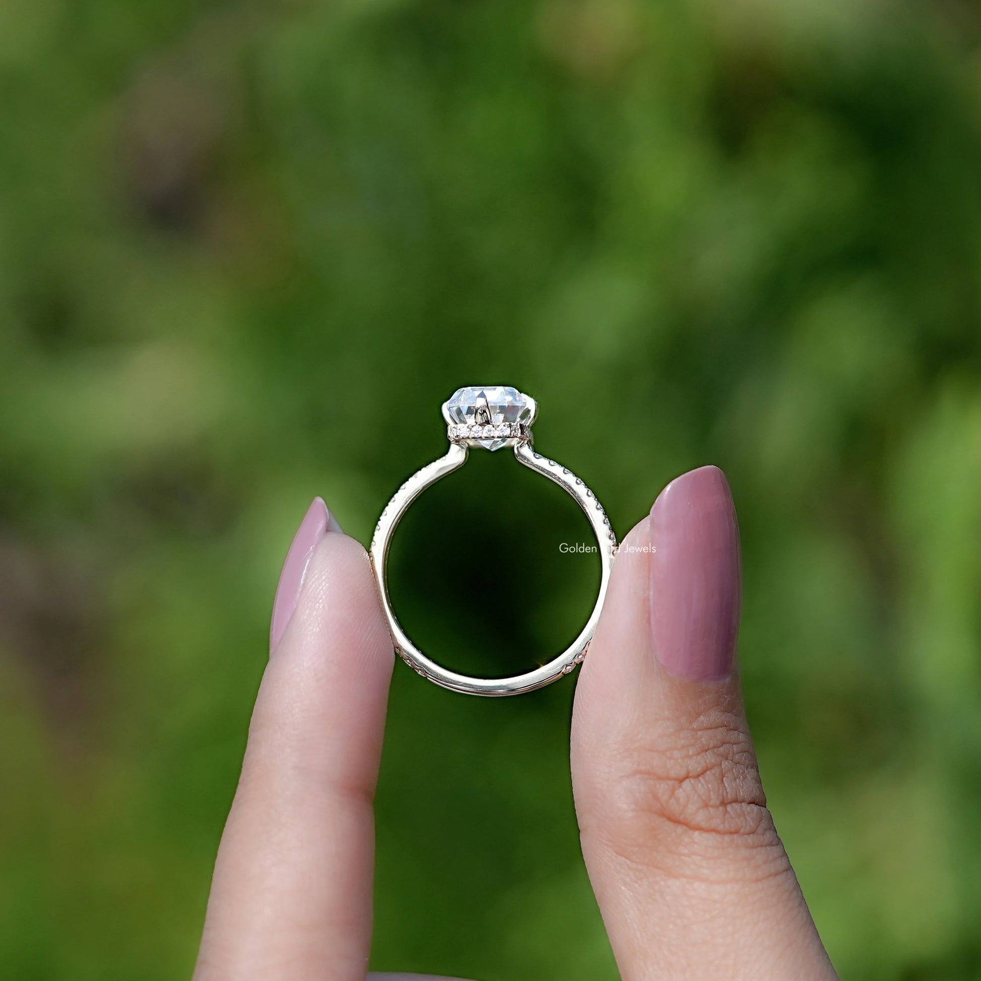Back view of Emerald Cut Moissanite Hidden Halo Engagement Ring in secure setting 