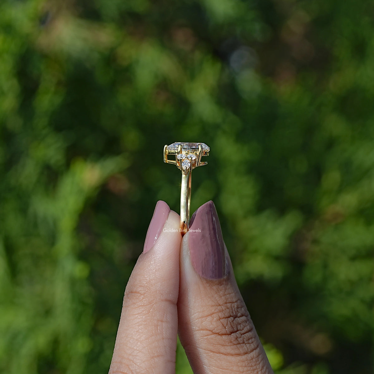 Side View of Pear cut moissanite Accent engagement ring
