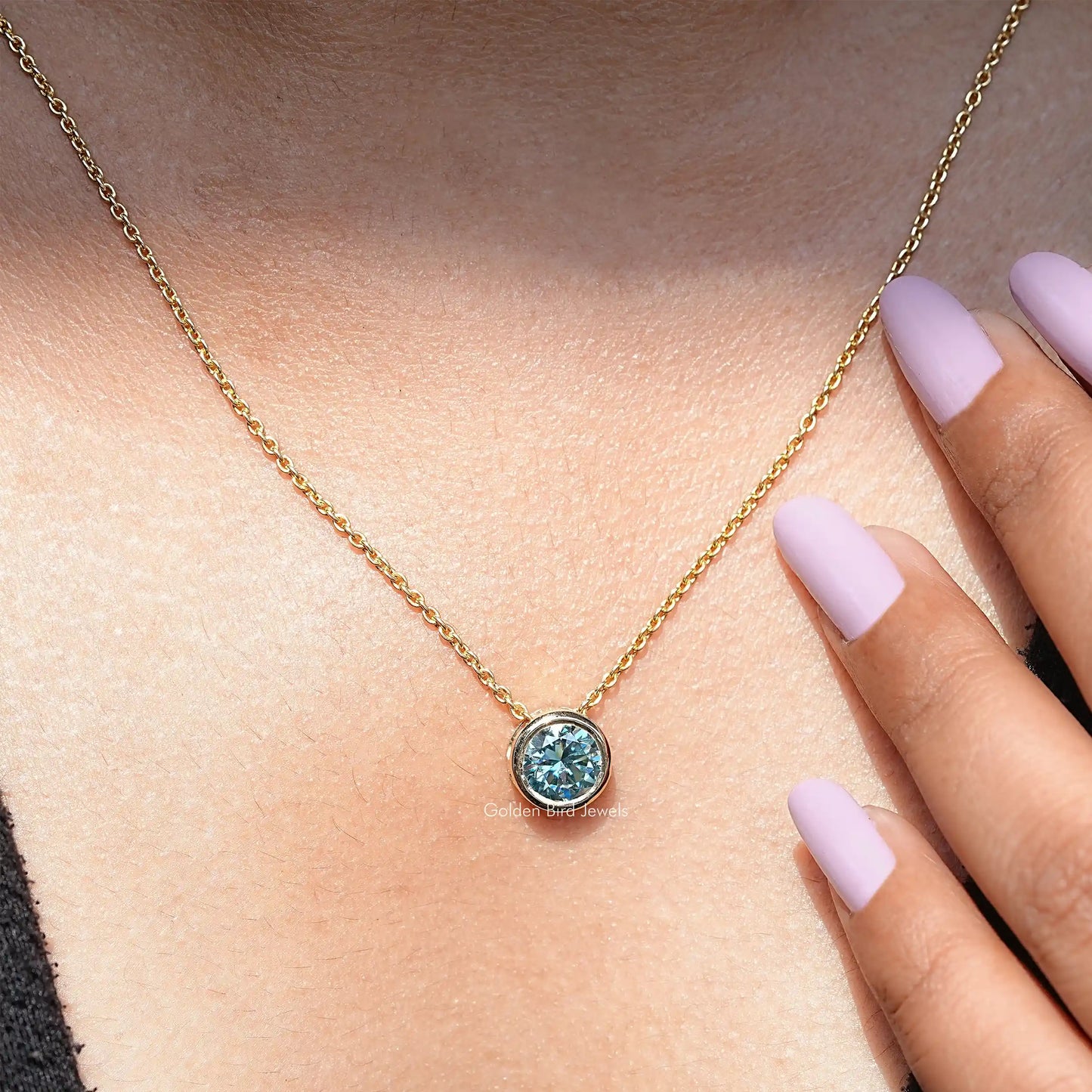 In neck view of aqua blue moissanite halo pendant 