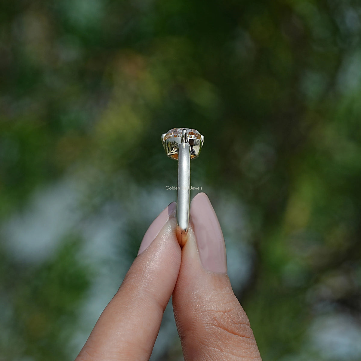 Side Stone View of  Pear Shape Moissanite Ring