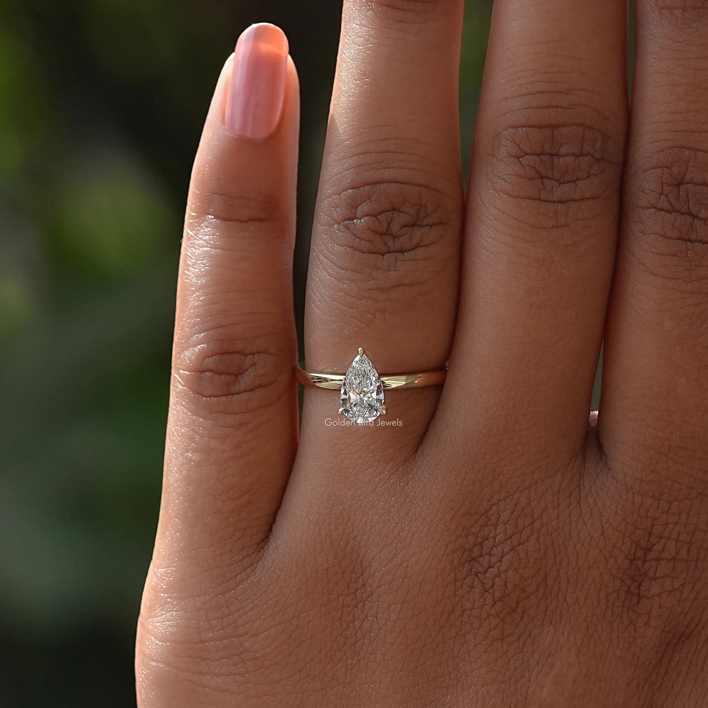 View of Pear Cut Diamond Shaped Solitaire Ring In Yellow Gold