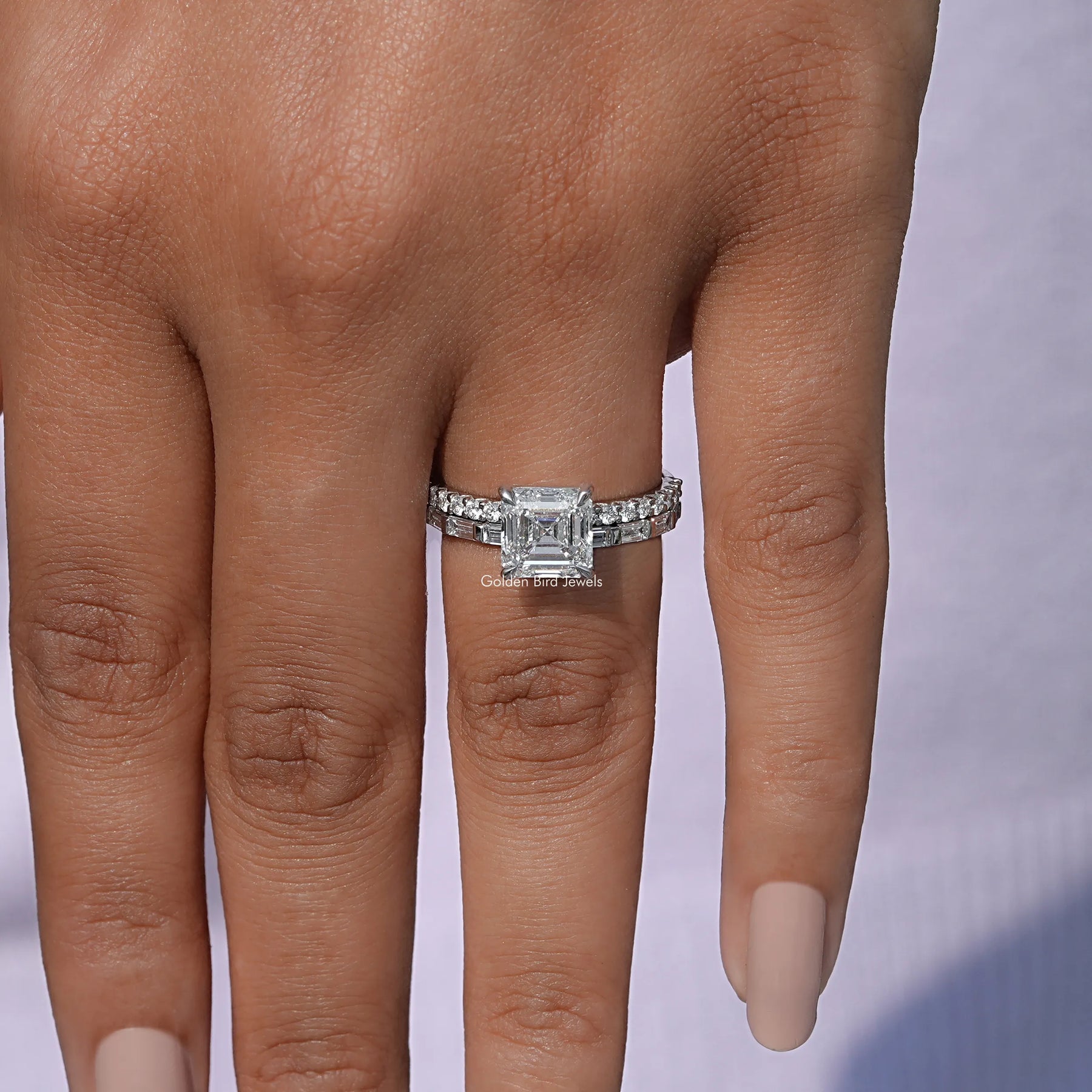 On finger front view of Emerald Cut Diamond Wedding Ring Set