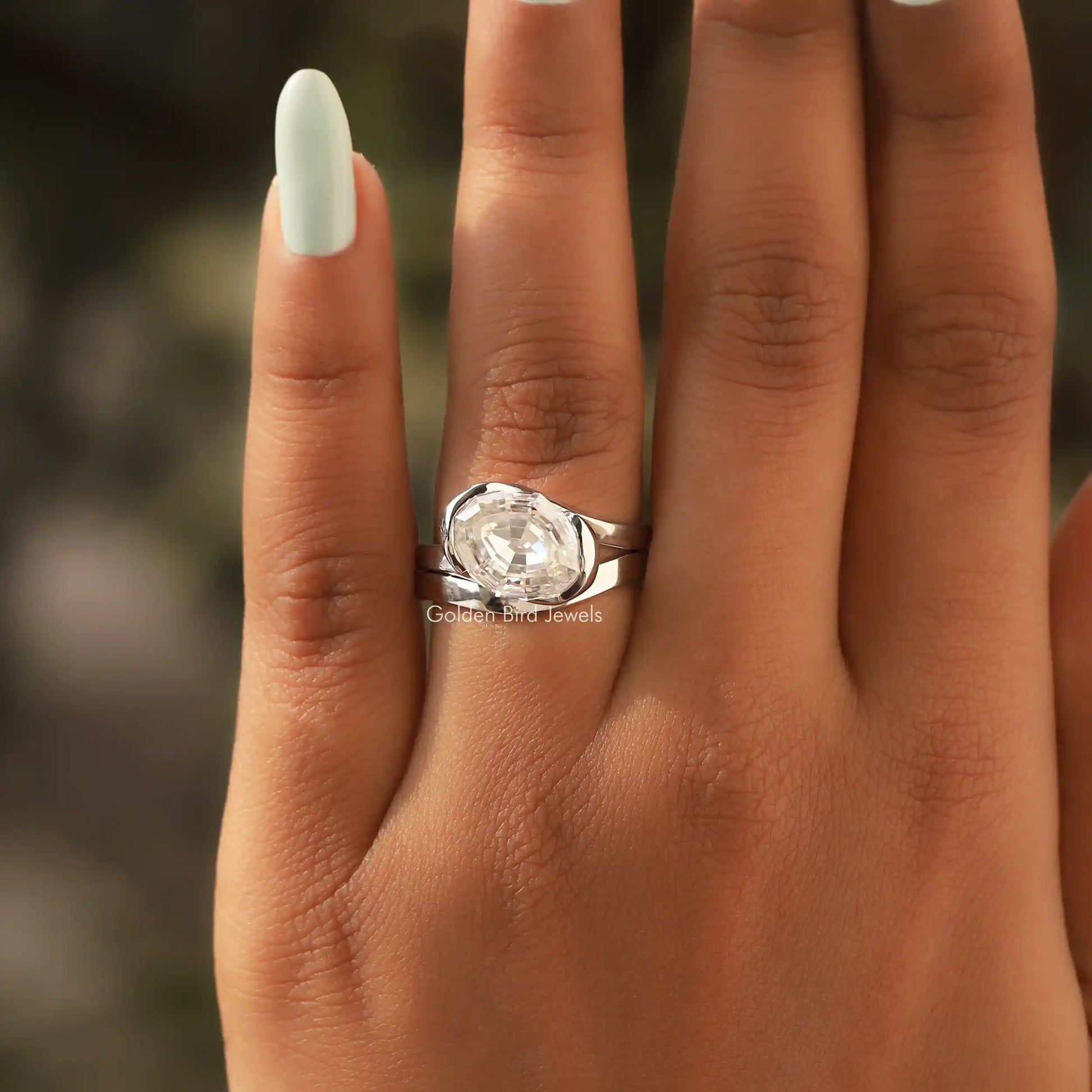 Detailed View Of Step Cut Oval Moissanite Bypass Ring In White Gold