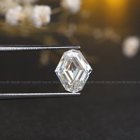 Tweezers holding the  Step Cut Moval Shape Loose Moissanite